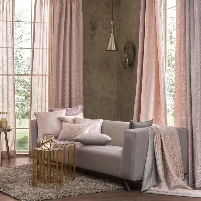 Beige fabric sofa with pink curtains