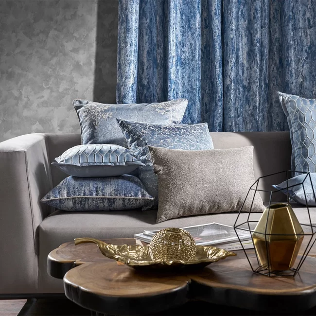 Grey sofa with blue fabric cushions