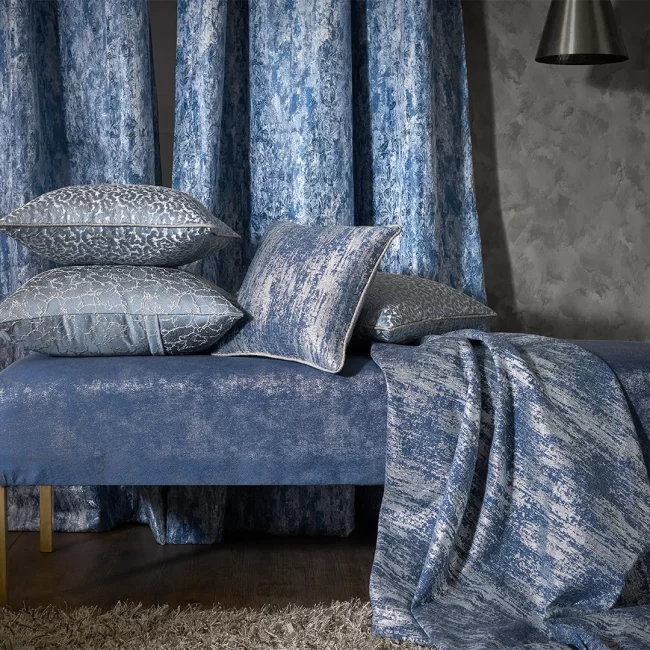 Blue upholstered daybed with pillows