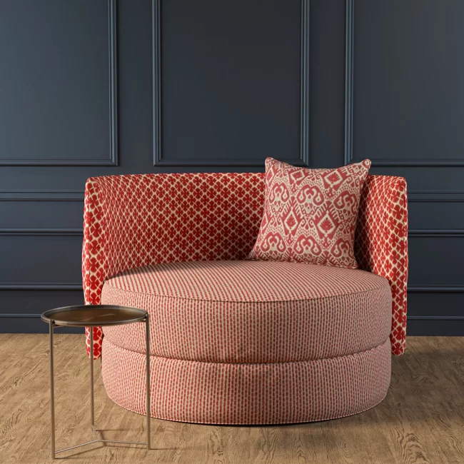 Red patterned round sofa with cushions
