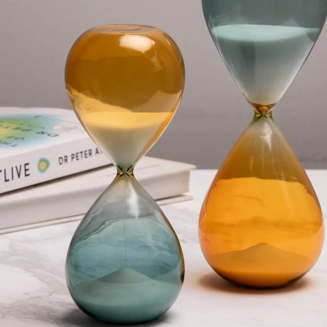 Dual hourglass timer in teal and amber